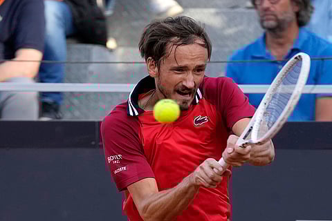 Daniil Medvedev returns the ball to Tommy Paul
